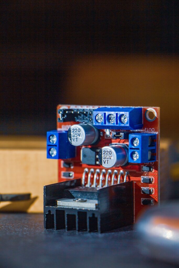 Detailed view of a red circuit board component for tech and robotics projects.